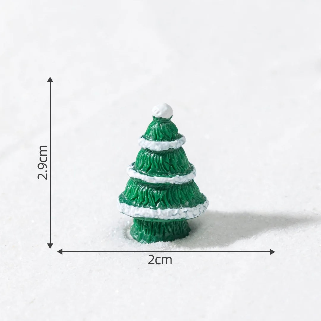 A small, green, conical Christmas tree charm with white icing trim and a white ball topper.