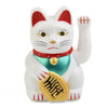 A white ceramic fortune cat figurine wearing a red collar and holding a gold coin.