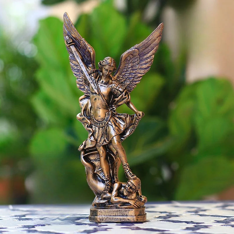 Bronzed Saint Michael Archangel resin figurine with outstretched wings and a sword.