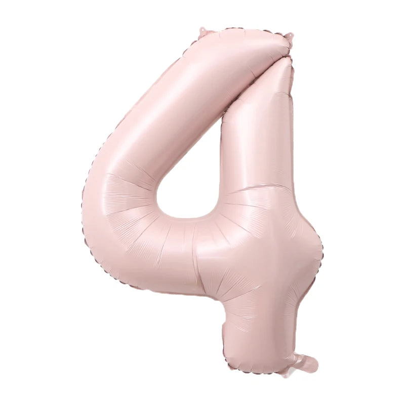 A pink foil number balloon shaped like the number 4.