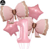 A set of pink bow disposable party tableware featuring star-shaped balloons and a large pink number one balloon.