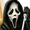 A person wearing a realistic ghost face mask with a screaming expression and a black hood.