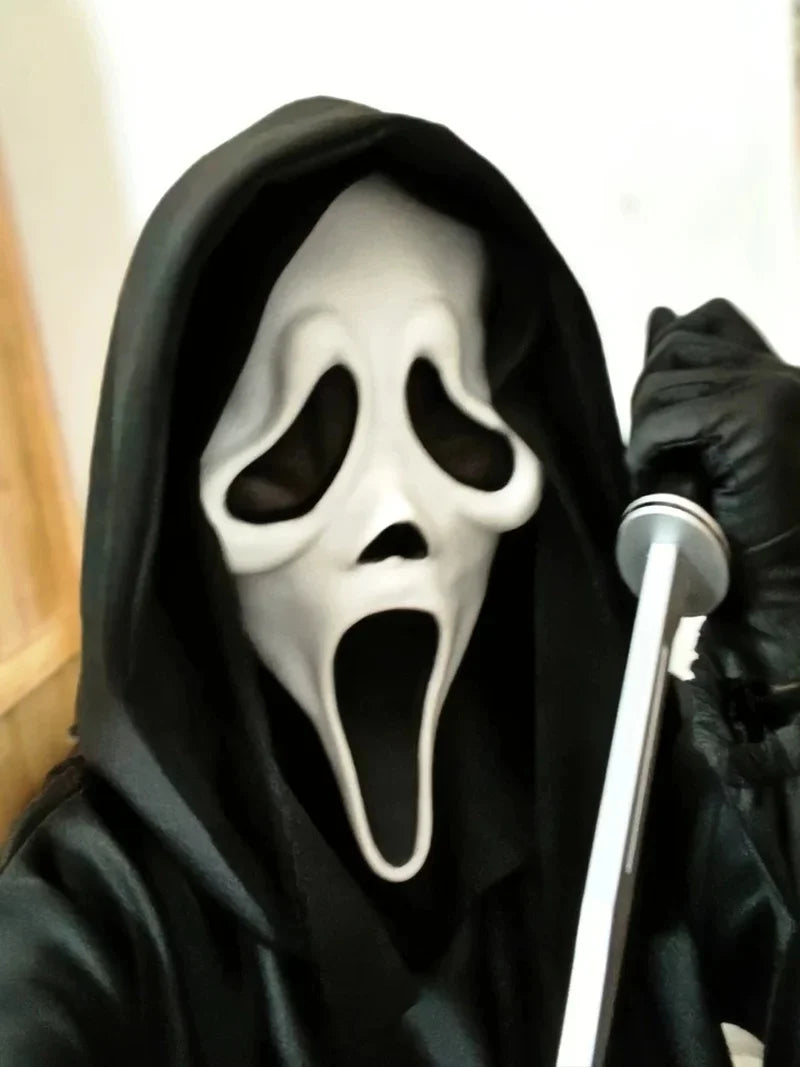 A person wearing a realistic ghost face mask with a screaming expression and a black hood.