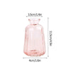 A modern clear glass vase with a rounded neck and tapered body, pink in color.