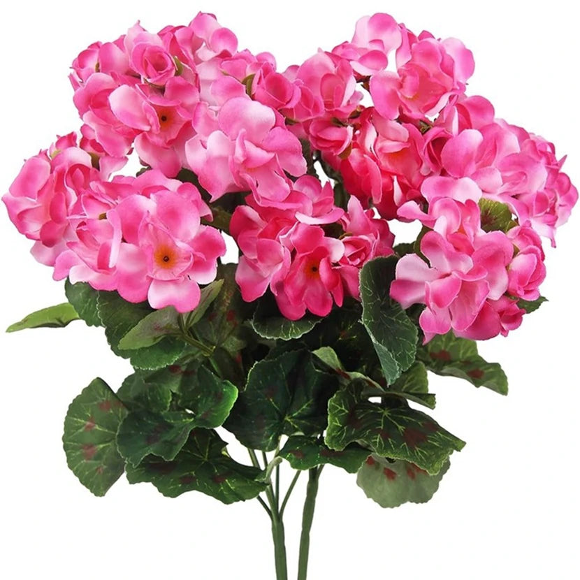 A bouquet of vibrant pink silk begonia artificial flowers with green leaves.