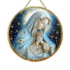 A translucent acrylic Mary suncatcher depicting the Virgin Mary with a halo and radiant light against a dark blue starry back