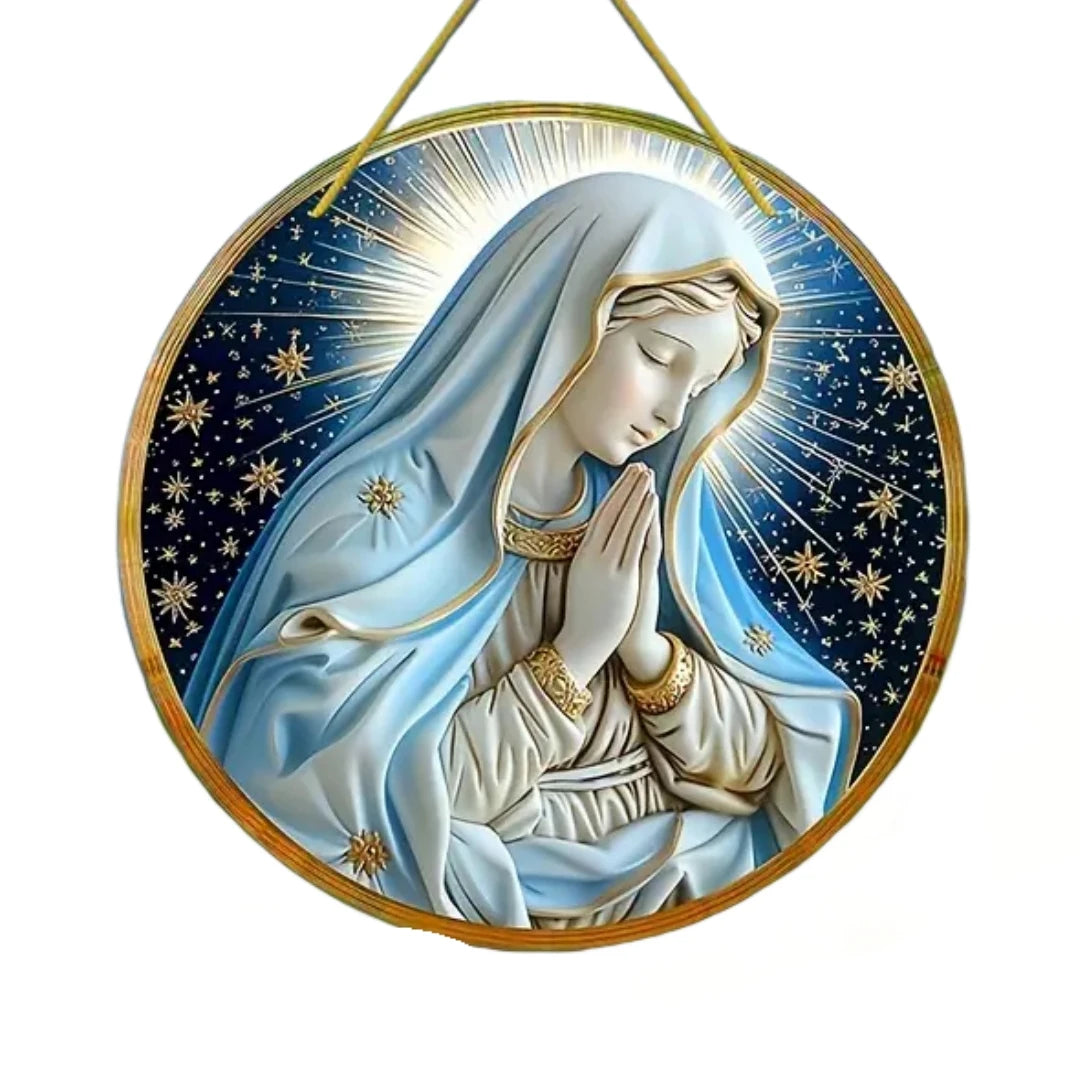 A translucent acrylic Mary suncatcher depicting the Virgin Mary with a halo and radiant light against a dark blue starry back