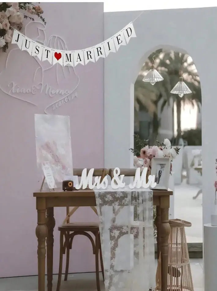 Wooden Mr & Mrs decorative letters for weddings and home displayed on a wooden table.