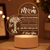 A decorative acrylic night light featuring a heart shape engraved with 'M&M' and loving sentiments.