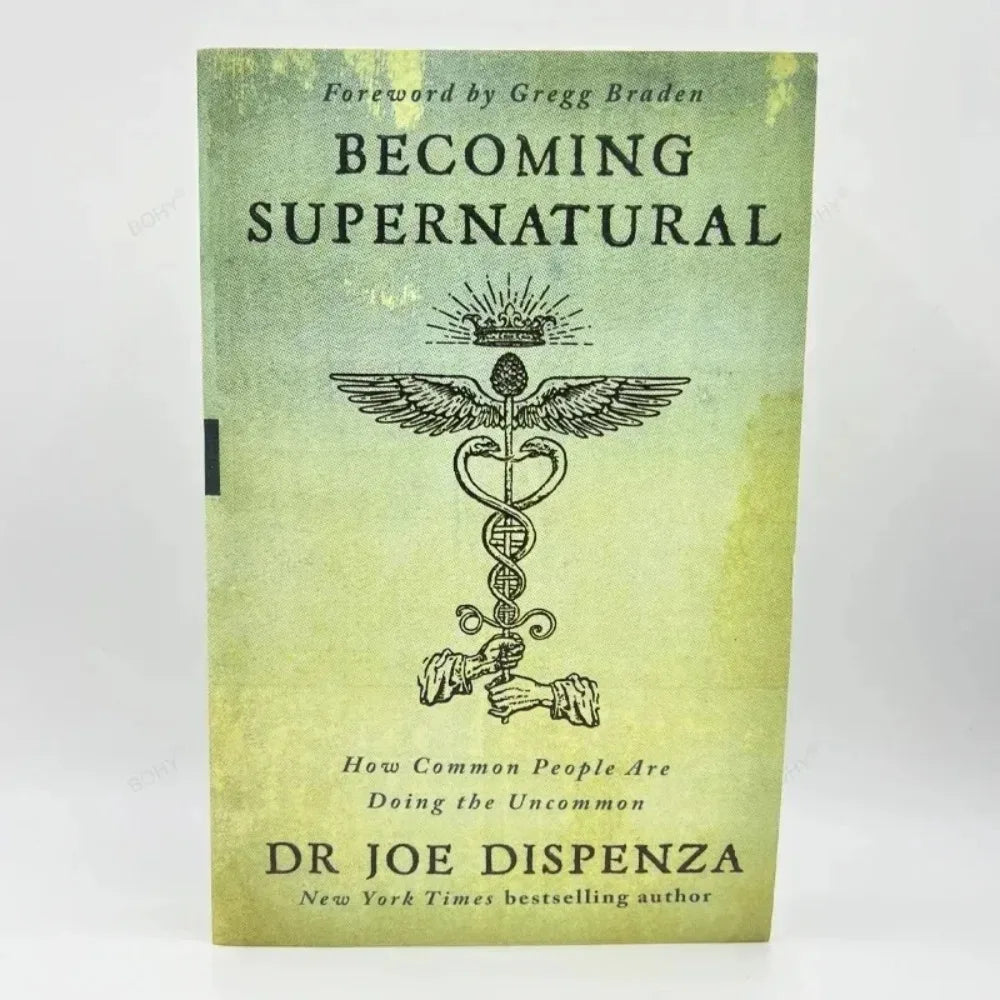 A paperback book titled Becoming Supernatural by Dr Joe Dispenza featuring a stylized winged heart symbol.