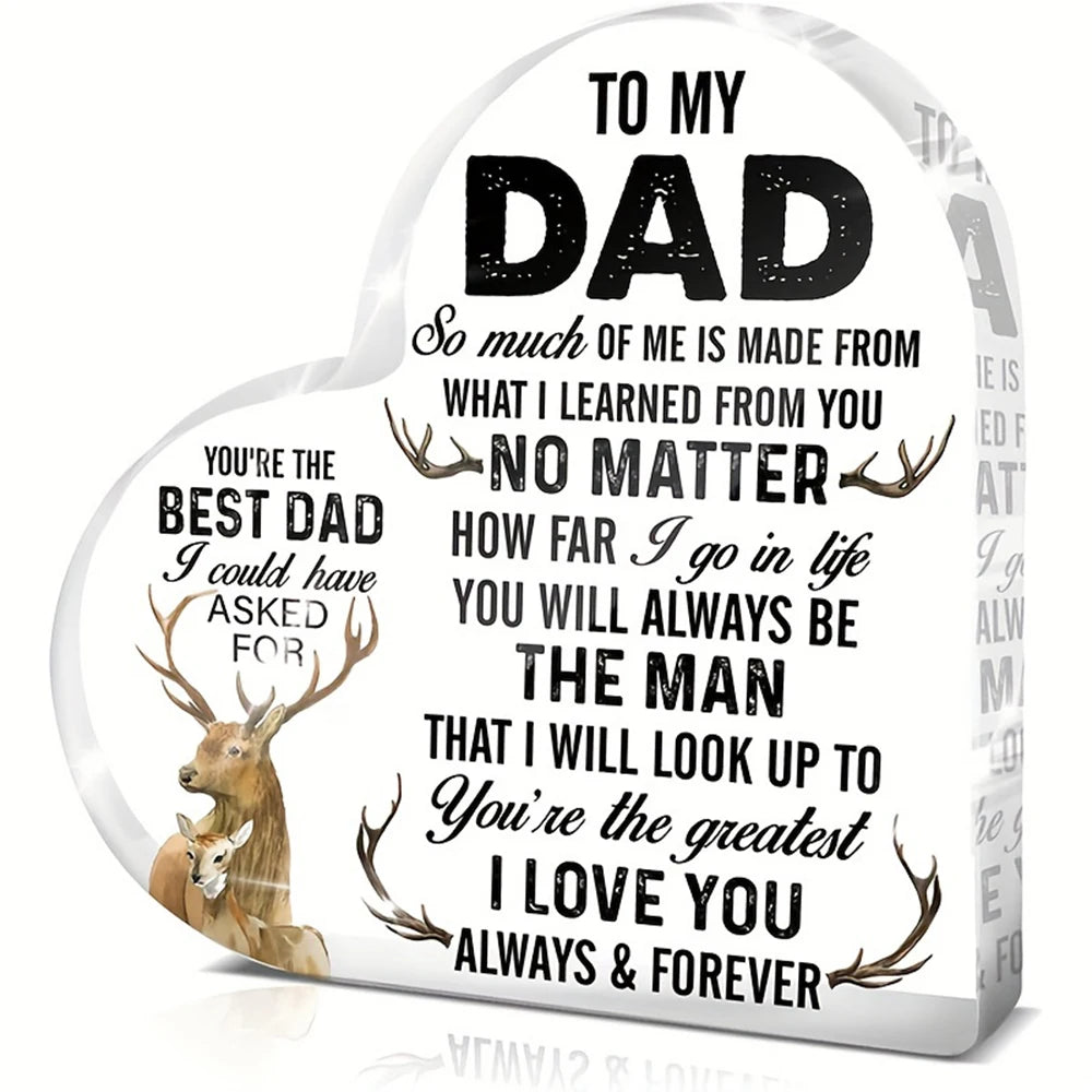 A heart-shaped wooden sign with text dedicated to a dad, featuring a deer silhouette.