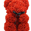 Künstlicher Rosen-Teddybär in leuchtend orange Farbe.
