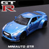 A blue 1:32 scale diecast GTR sports car model with a black hood and front grille.