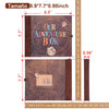 A brown vintage scrapbook photo album with a cover featuring the text Our Adventure Book and a small illustration.
