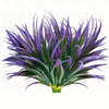 A vibrant purple artificial tall grass and tropical flower arrangement for indoor or outdoor decor.