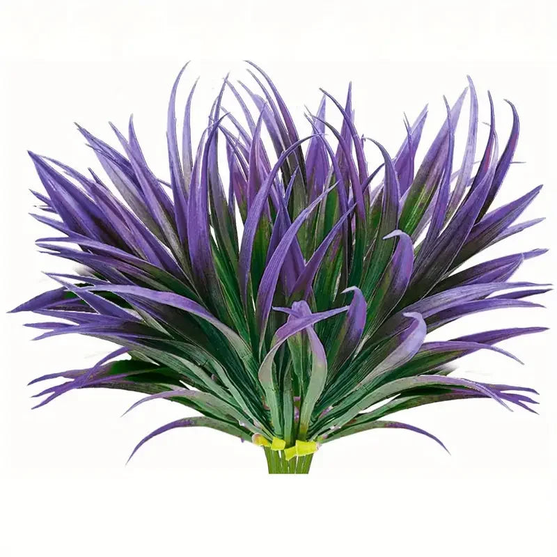 A vibrant purple artificial tall grass and tropical flower arrangement for indoor or outdoor decor.