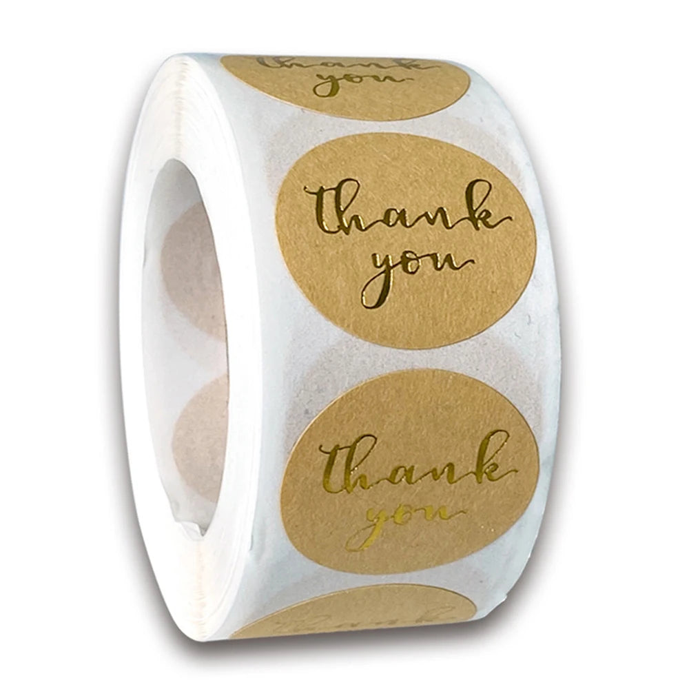 Roll of kraft paper thank you stickers with round labels featuring the text thank you
