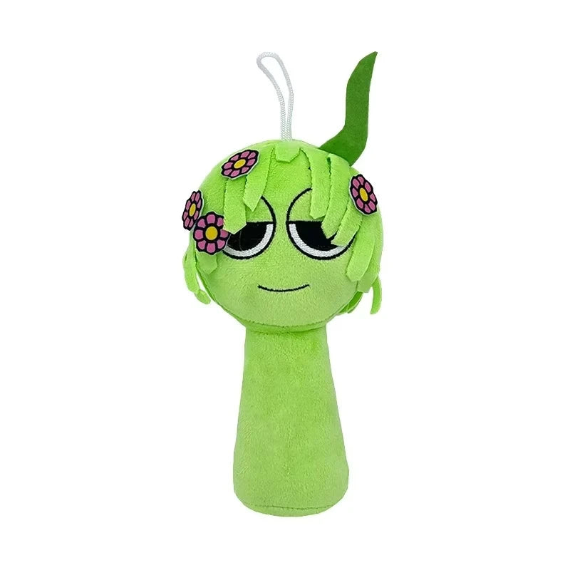 A bright green plush toy with purple flowers on its head and a long white string.
