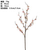 A branch of plum blossoms with pink flowers and stems.