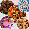 A collection of various silicone candy molds, colorful jelly candies, and gingerbread-like treats for DIY crafting.
