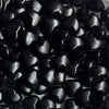 A close-up view of small, glossy black heart-shaped acrylic decoration beads.