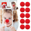A child is holding a red foam clown nose, demonstrating the product for costumes and parties.
