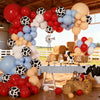 A vibrant balloon garland featuring red, white, orange, and blue balloons arranged in an archway.