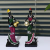 Hand-painted resin statue of an African tribal lady with gold jewelry and colorful attire.