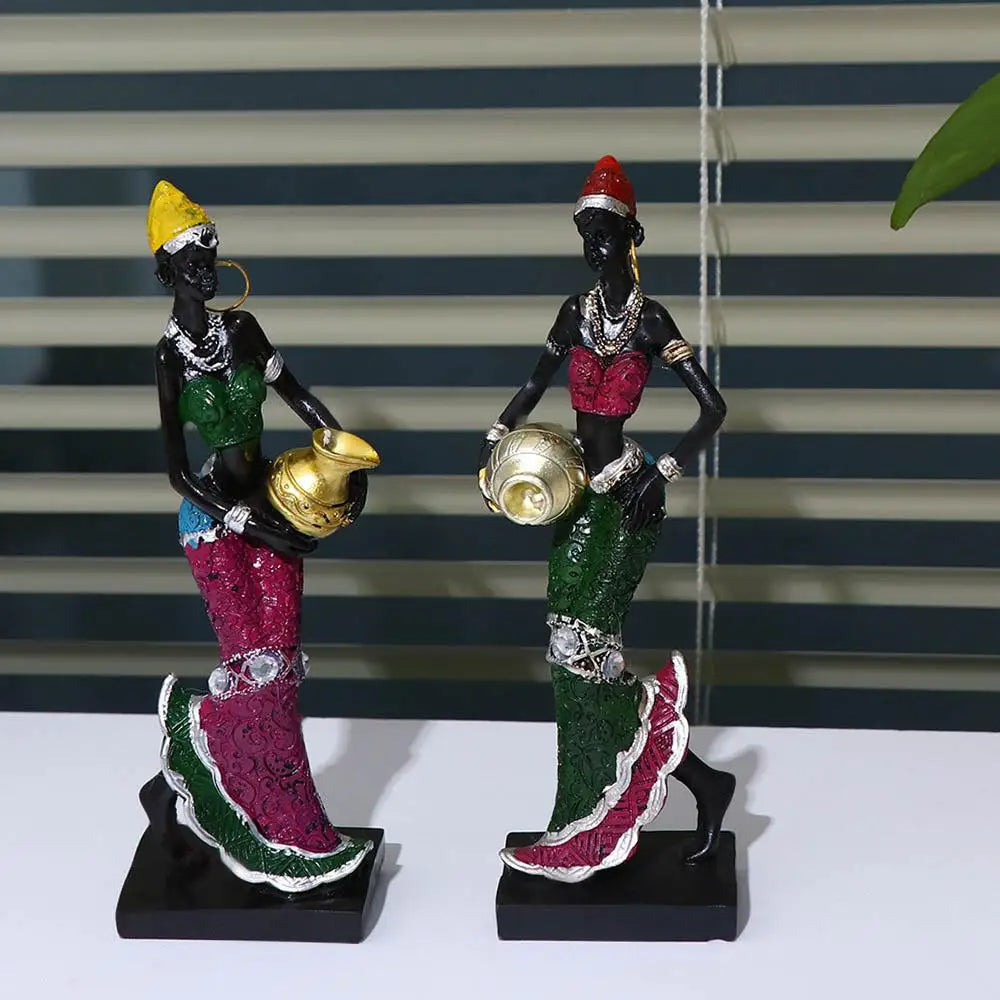Hand-painted resin statue of an African tribal lady with gold jewelry and colorful attire.