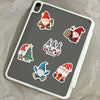 A tablet displaying a pack of Christmas dwarf stickers featuring Santa and festive decorations.