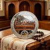 A commemorative coin set depicting Jesus' Last Supper with a cross design, displayed on a wooden surface.