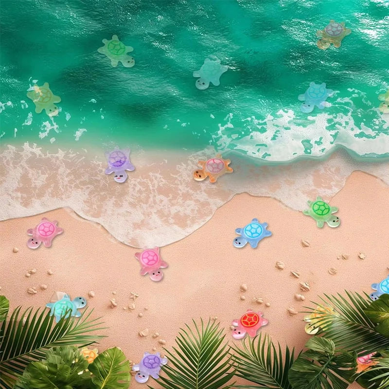 A collection of glow-in-the-dark resin turtle figurines scattered on a sandy beach near the ocean.
