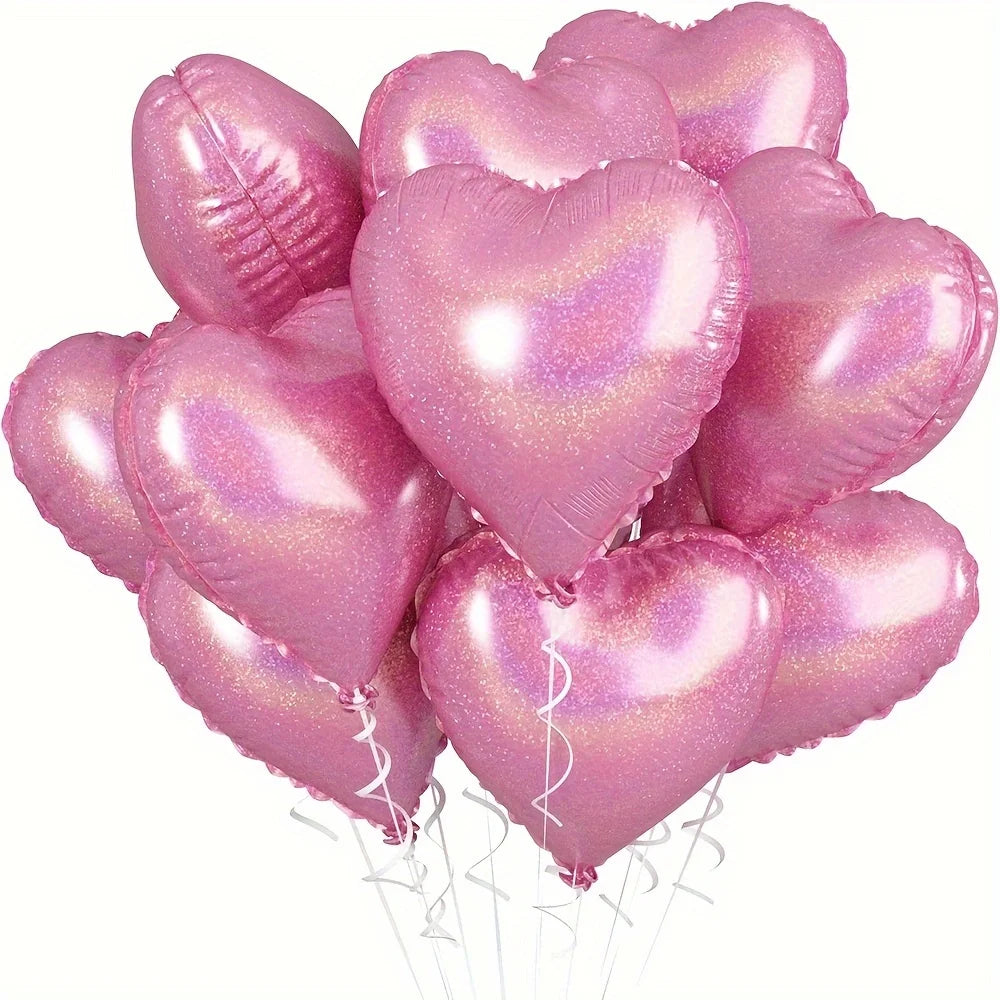 A bunch of ten pink heart-shaped foil balloons tied together, sparkling with glitter.