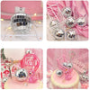 Silver disco mirror balls displayed in various packaging and on a pink cake for parties and decor