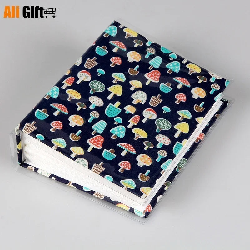 A colorful photo memory album featuring cartoon mushroom designs on the cover.