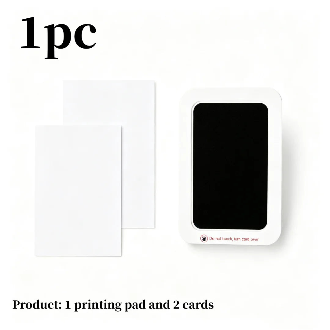 A white printing pad and two cards for a stain-free baby keepsake kit.