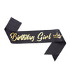 Black ribbon with gold text Birthday Girl and a crown design