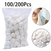 A bag of 100 to 200 compressed white disposable camping towels.