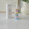 A set of five handcrafted soy wax aromatherapy candles in pastel colors displayed next to their packaging.