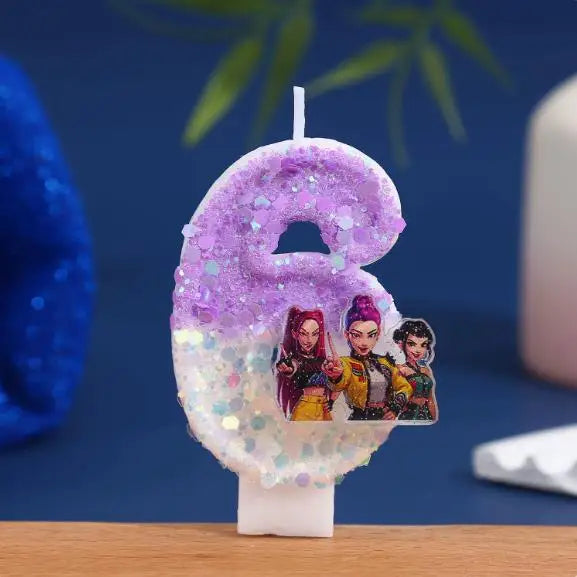 A purple glitter candle shaped like the number 6 featuring characters from a movie.