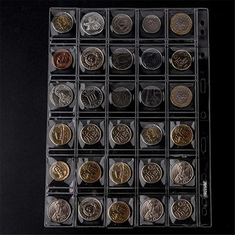 A clear plastic coin collection album displaying numerous coins arranged in compartments.
