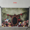 A flat 2D birthday banner featuring a dark wreath of roses and greenery with small animal figures.