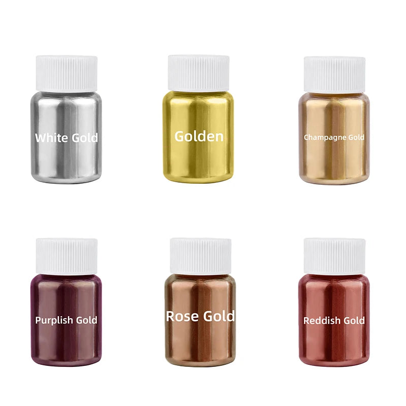 A collection of gold and silver glitter dust bottles with white caps, including White Gold, Golden, Champagne Gold, Purplish 