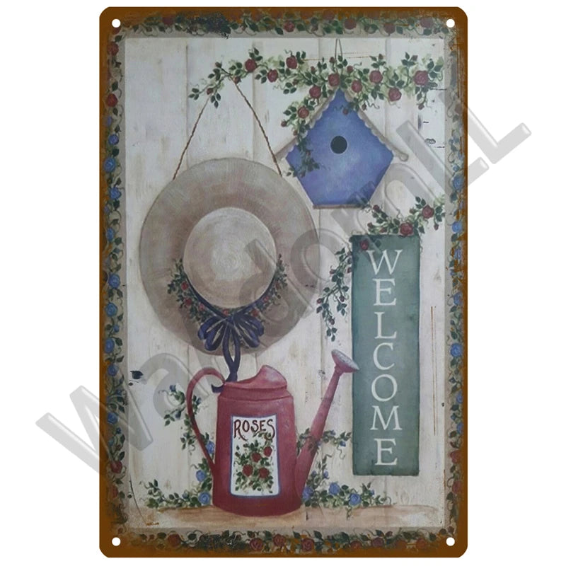 A vintage metal sign featuring a rustic teapot and floral elements, with the word WELCOME written vertically.