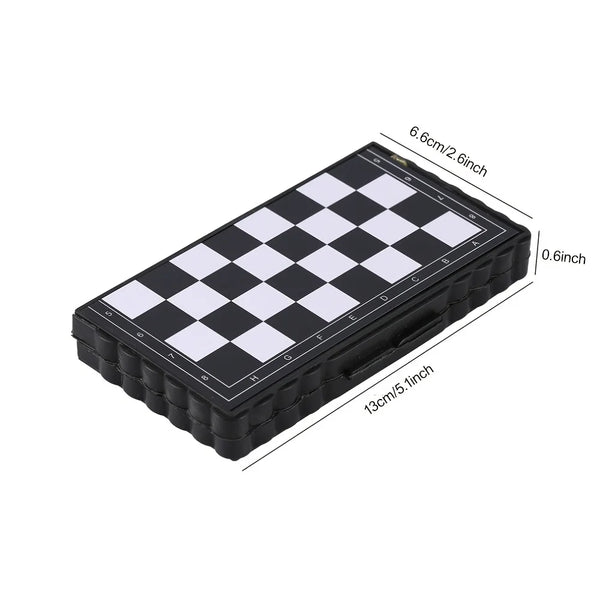 A black portable folding magnetic chess set with a white and black checkered board.