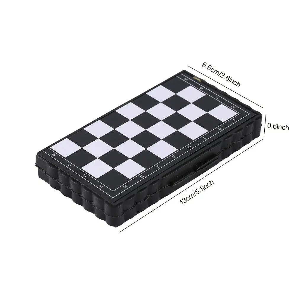 A black portable folding magnetic chess set with a white and black checkered board.