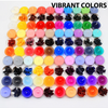 A large array of 34 vibrant colored candle dye blocks arranged in rows.