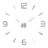 A silver-toned analog clock face with twelve hour markers and hands against a white background.