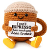 A handmade crochet donkey figurine with a smiling face holding an inspirational card.