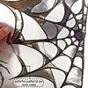 Halloween spider web window decals featuring colorful patterns on both sides